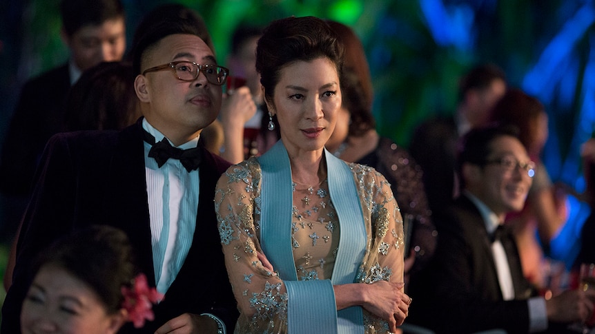 Colour still of Nico Santos and Michelle Yeoh in a scene from 2018 film Crazy Rich Asians.