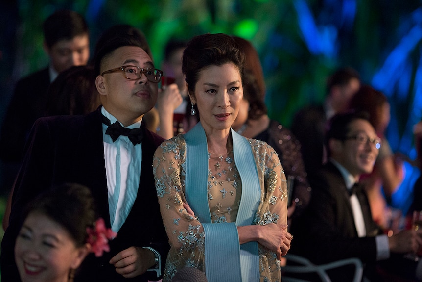Colour still of Nico Santos and Michelle Yeoh in a scene from 2018 film Crazy Rich Asians.