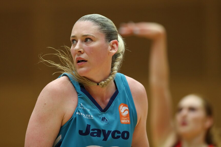 Lauren Jackson looks to one side with her ponytail sweeping under her chin