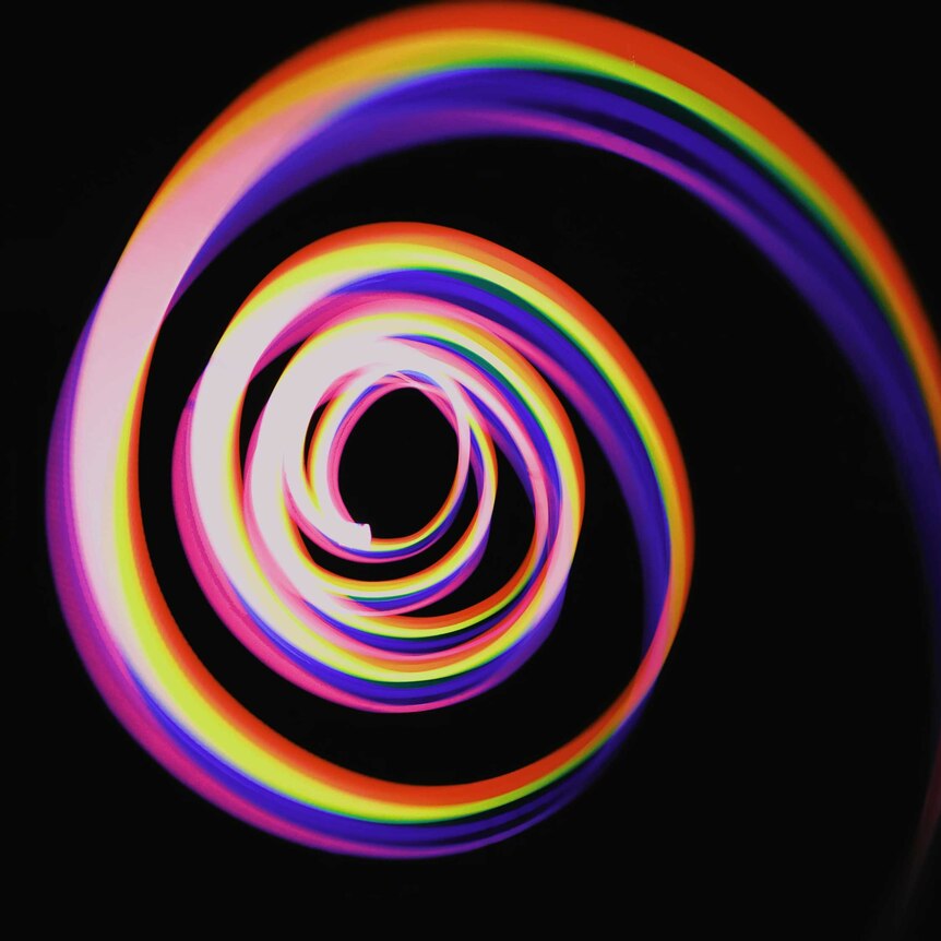 a multicoloured spiral of colours formed by photographing light. Abstract