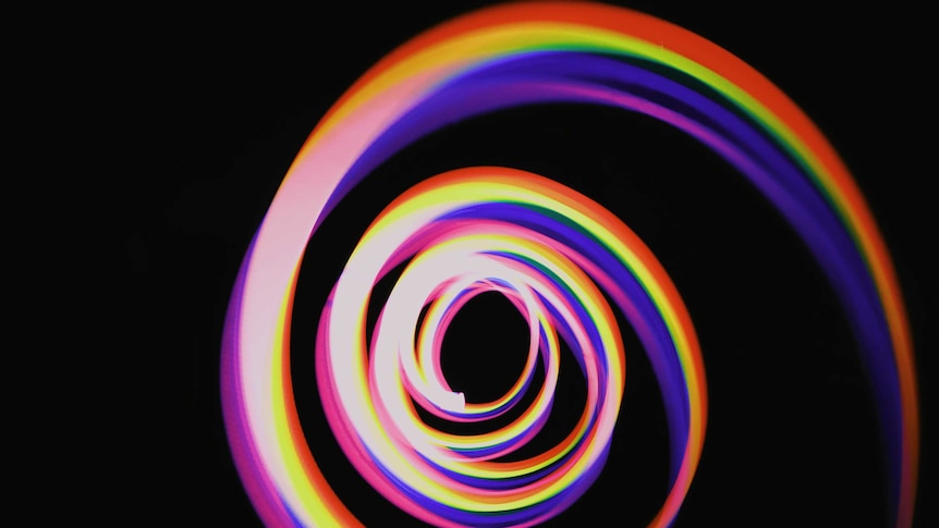 a multicoloured spiral of colours formed by photographing light. Abstract