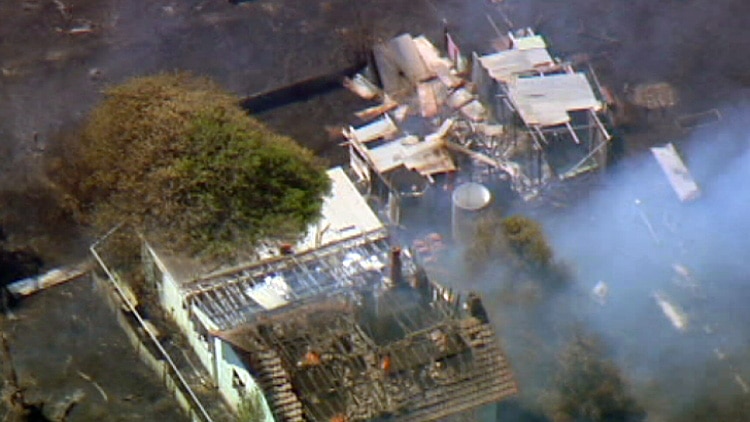 An aerial photo showing a damaged house.