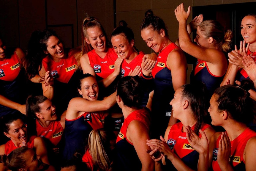 Melbourne's AFLW players smile and congratulate Daisy Pearce on her appointment as captain.