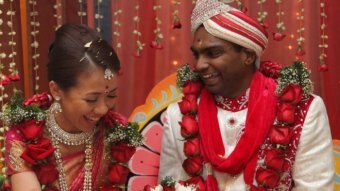 Matisse Yee and husband Vick Satgunasingam wear traditional Indian clothes at their wedding.