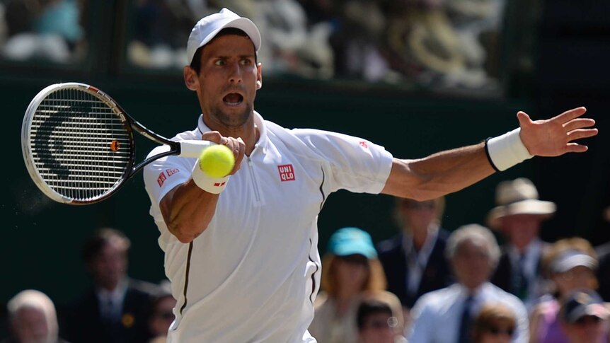 Serbia's Novak Djokovic returns against Britain's Andy Murray in the Wimbledon final