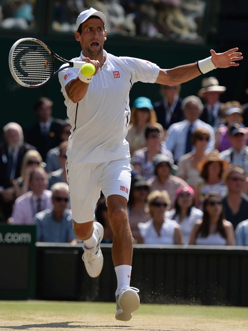 Serbia's Novak Djokovic returns against Britain's Andy Murray in the Wimbledon final