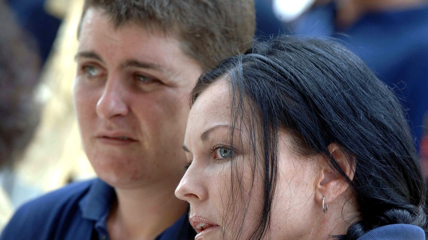 Schapelle Corby (R) and Renae Lawrence (L) sit together during a ceremony inside Kerobokan prison.