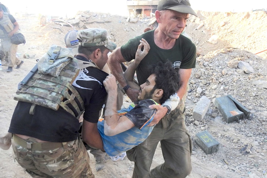 David Eubank saving a young Iraqi girl in Mosul