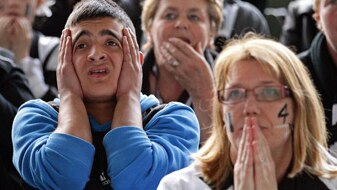 Collingwood fans react at full time (Getty Images: Scott Barbour)