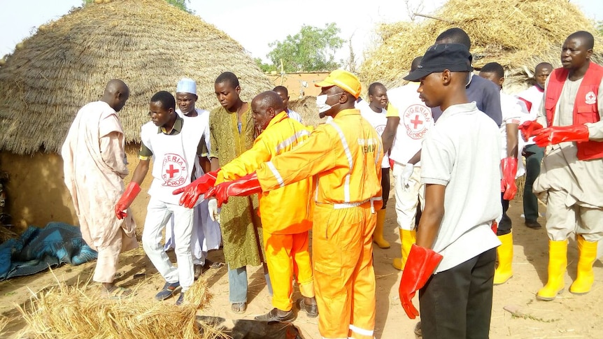 NEMA North East rescue workers attend to the bomb site.