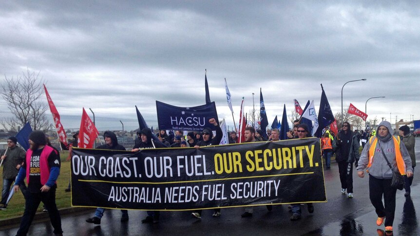 The rally drew protesters out in the rain to voice concerns about maritime job security in Australia.
