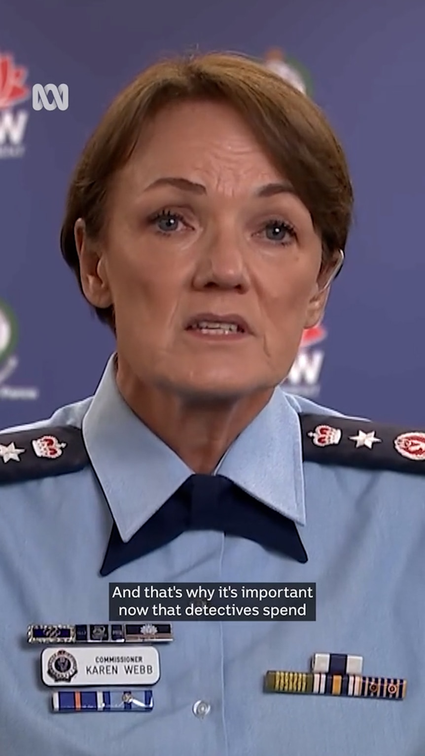 Women in police uniform looks straight ahead