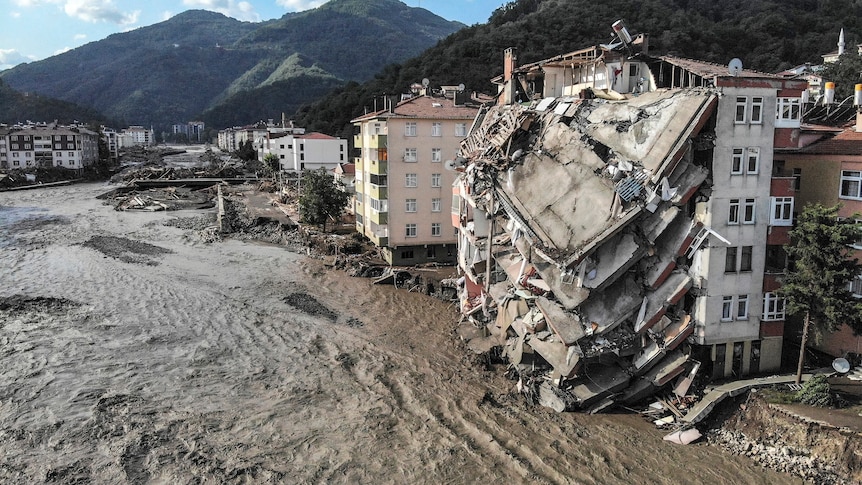 An aerial photo shows destroyed buildings after floods and mudslides