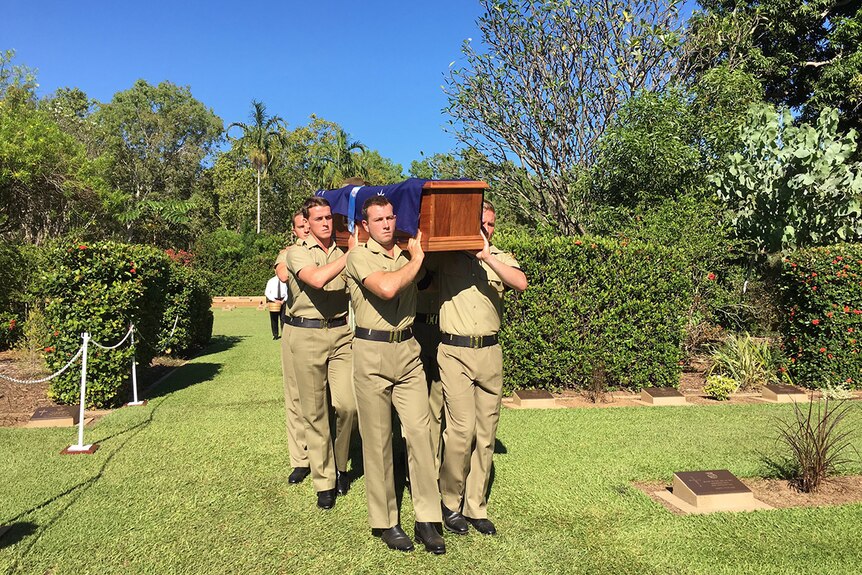 Soldiers carry the coffin of Corporal Reg Hillier