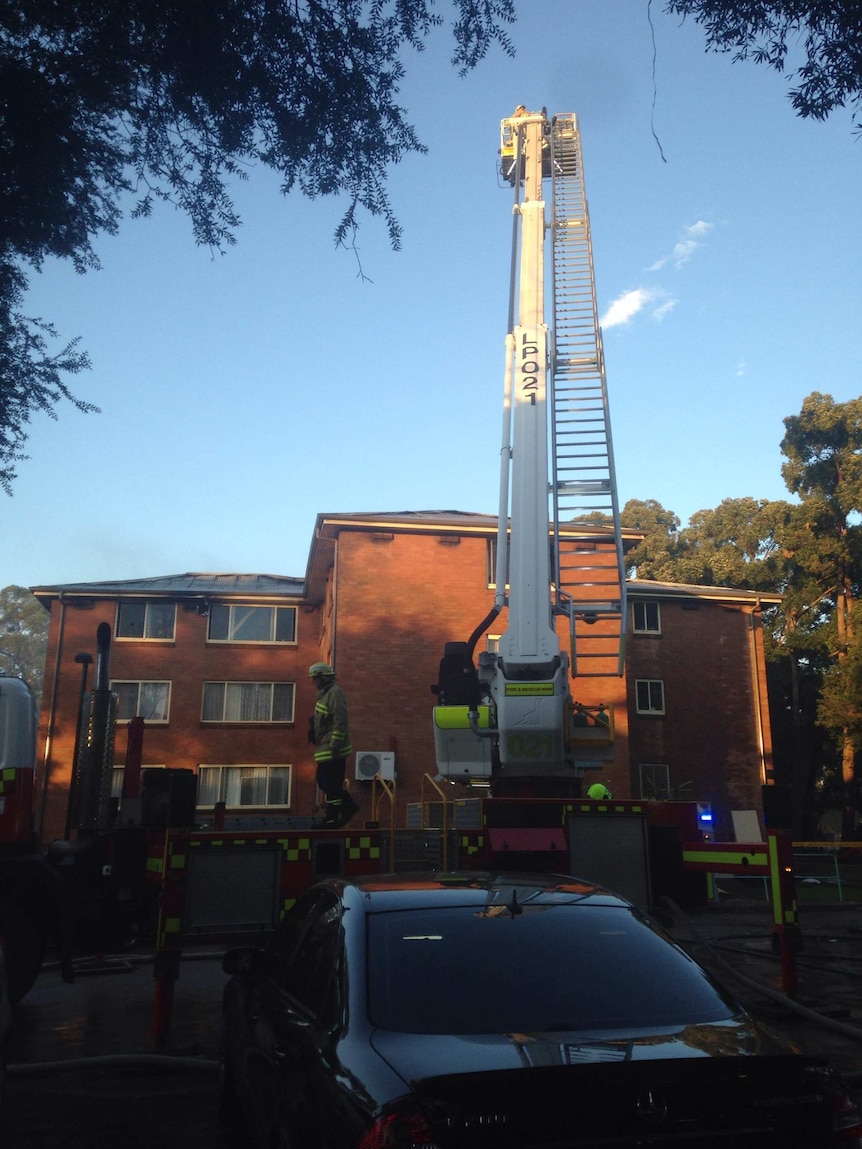 Firefighters used ladders to rescue residents from the burning unit building.