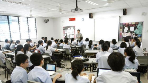 A teacher talking to students.