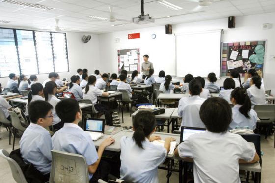 A teacher talking to students.