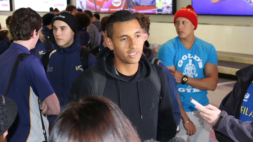 Nick Kyrgios arrives home at Canberra Airport after his impressive Wimbledon debut.