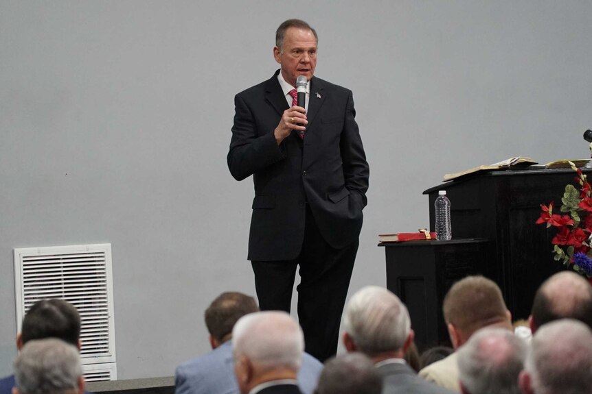 Roy Moore on stage at the "God Save America" Christian revival gathering in Jackson, Alabama.