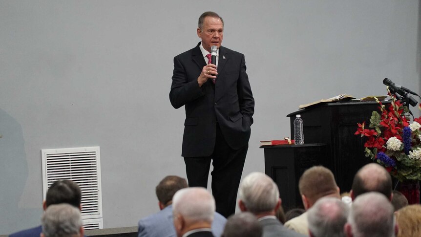 Roy Moore on stage at the "God Save America" Christian revival gathering in Jackson, Alabama.