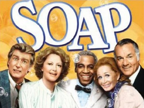 A promotional image of two female and three male actors looking down the camera with the word soap written above their heads