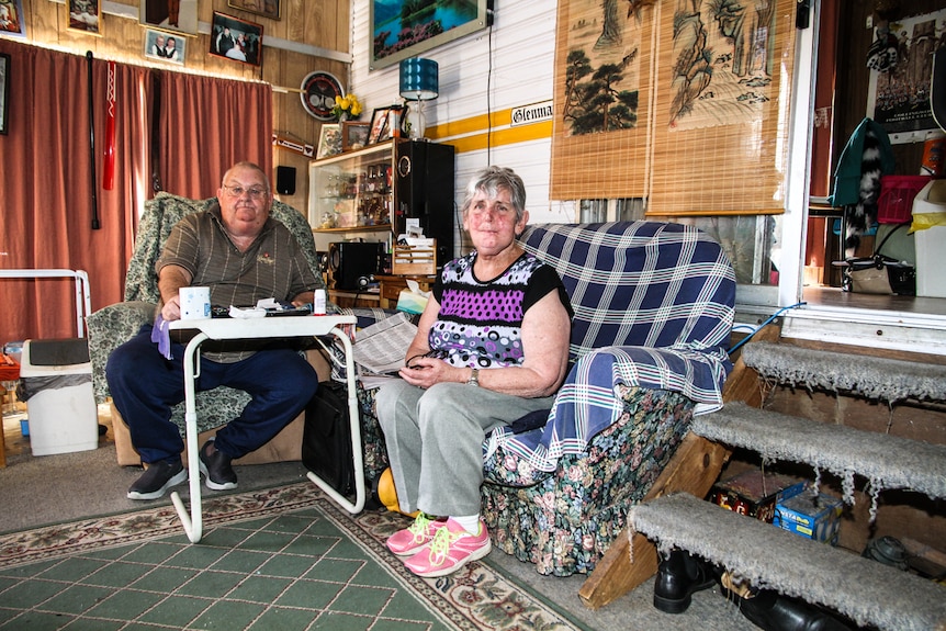 Larry and Lyn Fox seated inside the annexe of their caravan.