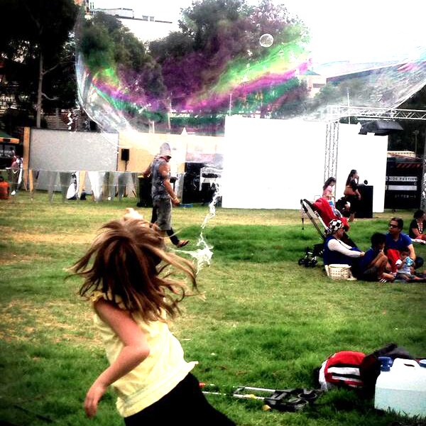 Girl playing with bubbles at Adelaide Festival launch