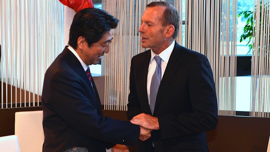 Tony Abbott and meets Shinzo Abe are both at the World Economic Forum in Davos, Switzerland.