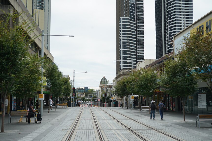 a city street with tram tracks