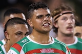 Latrell Mitchell stands with South Sydney Rabbitohs teammates during an NRL match against Penrith Panthers.