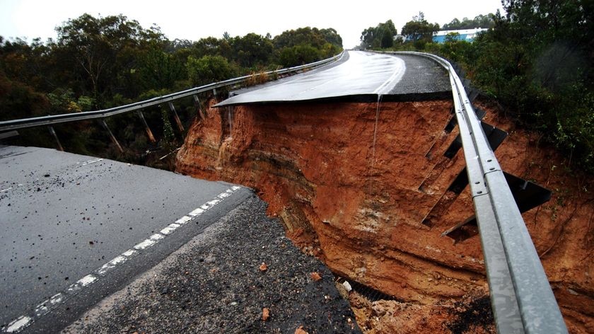 Swept away: The scene of the road collapse which killed a family of five