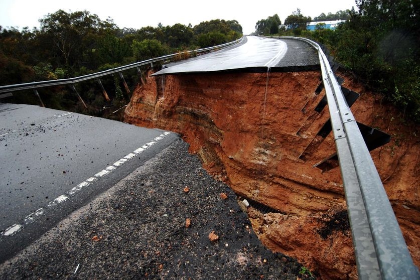 Swept away: The scene of the road collapse which killed a family of five