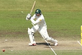 Usman Khawaja plays a shot for the CA XI against New Zealand