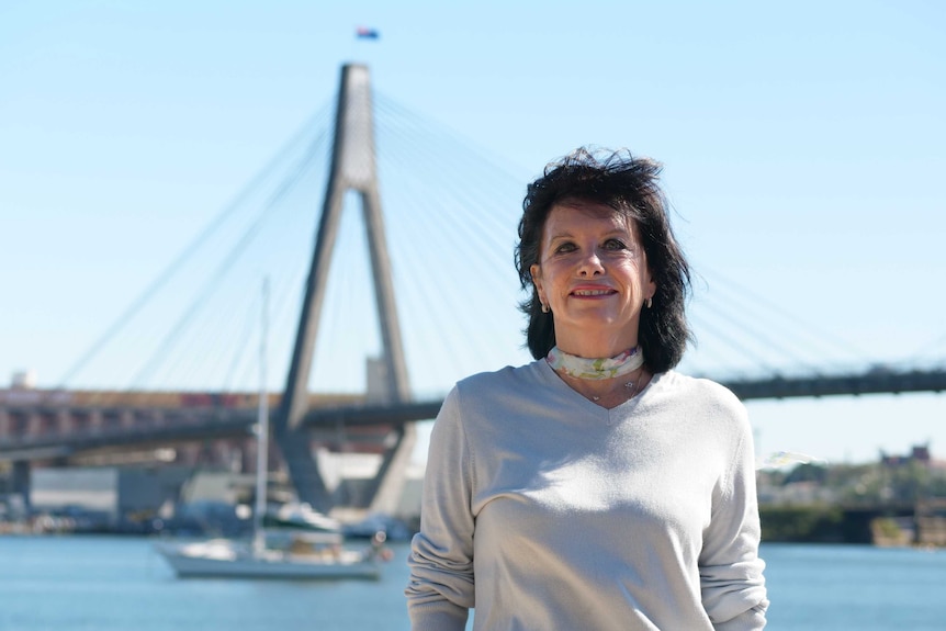 Vicki Davison stands in front of the Anzac Bridge, which her grandfather Charlie Mance helped dedicate to the Anzacs.