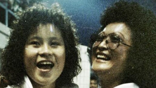 Smiling mother and daughter in a pic from the 1980s.
