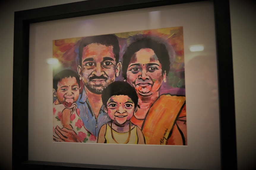A painting of a Sri Lankan family, the mum, dad and two young girls