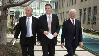 Independents Tony Windsor, Rob Oakeshott and Bob Katter walking in step through the grounds of Parliament House (AAP: Mark Gr...