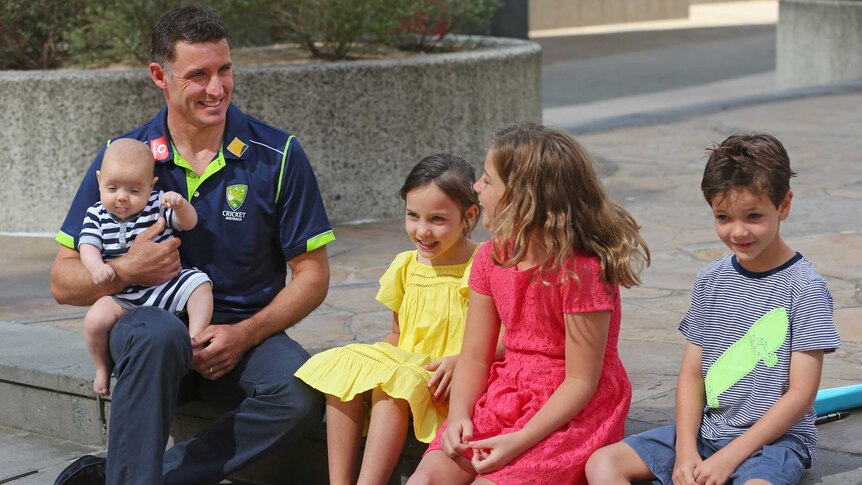 Hussey with family