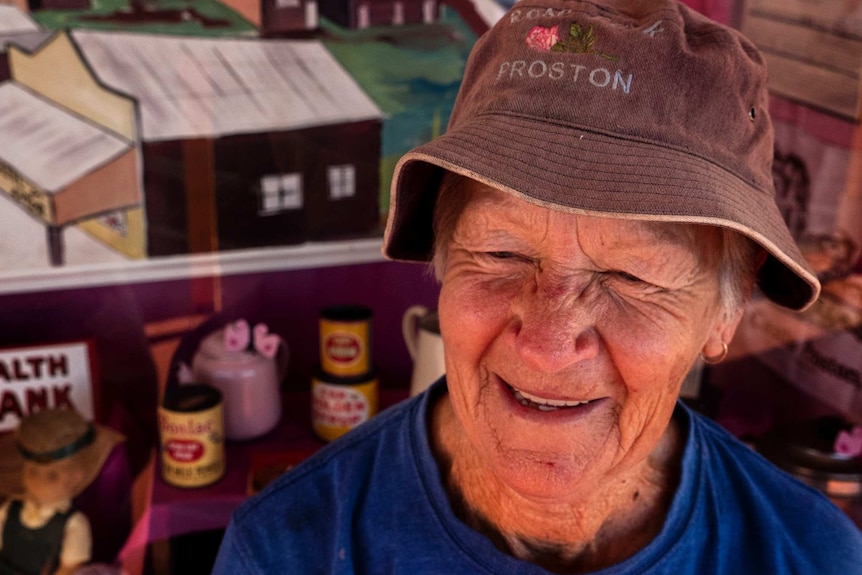 A woman wearing a Proston hat.