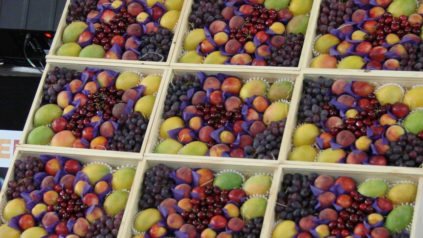 Display of summer fruit cherries, mangoes, peaches and grapes at Sydney Markets Homebush NSW