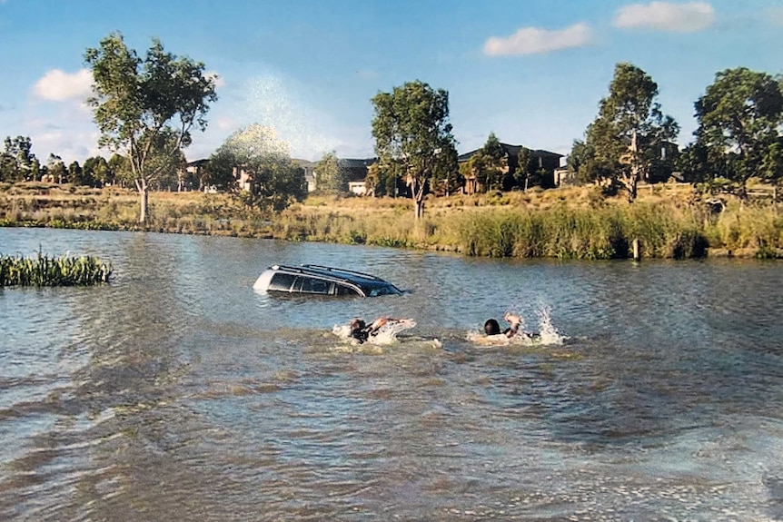 Rescuers attempt to save the children of Akon Guode in April 2015.