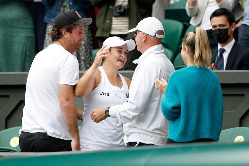 Ash Barty, centre, in the players box as she celebrates her win