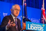 Malcolm Turnbull speaks at a podium, surrounded by Tasmanian Liberal Party banners.