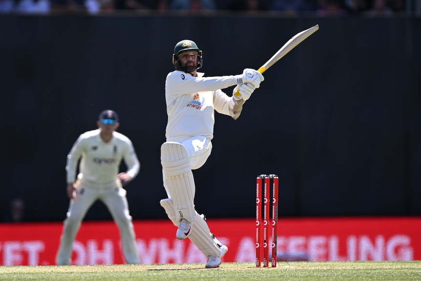 Australia batter Nathan Lyon plays a cross-bat shot during a Test against England in Hobart.