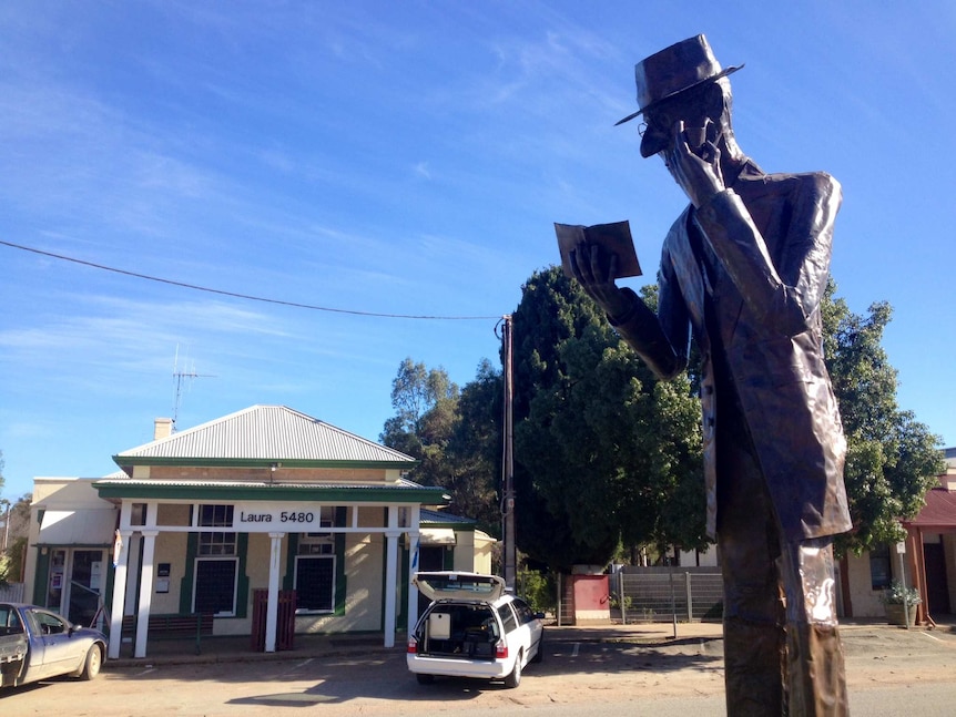 There is a statue of C J Dennis at Laura