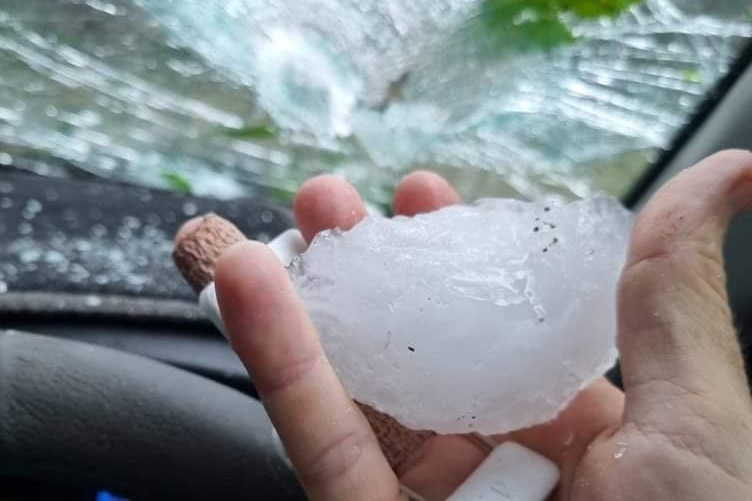 hail in front of a smashed windscreen