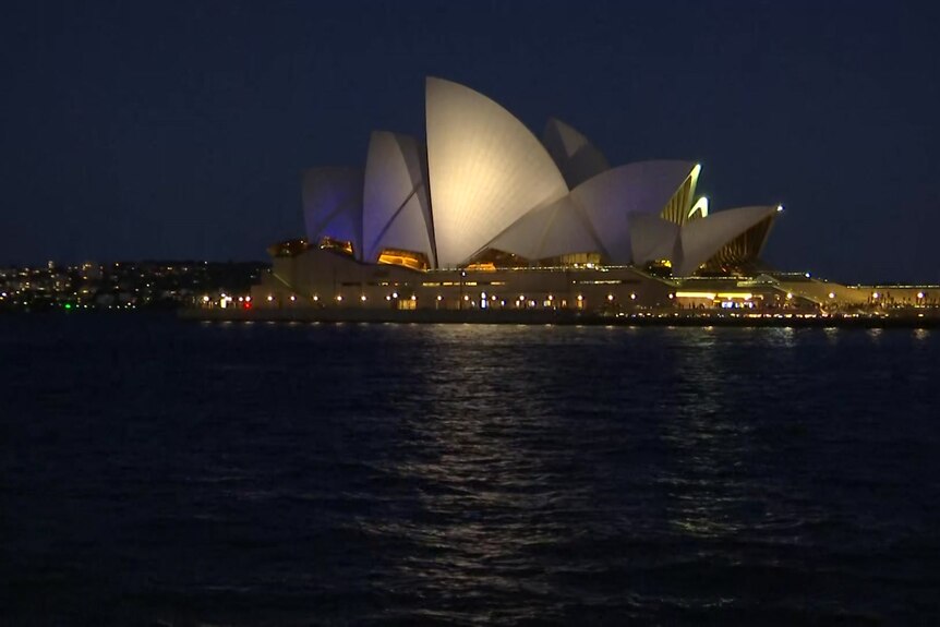sydney's opera house sails lit up in the colours of the Israeli flag  on Monday October 9