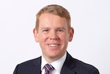 Profile photo of smiling Chris Hipkins wearing suit and tie