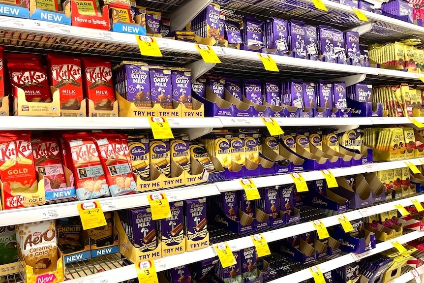 a supermarket aisle filled with chocolate products