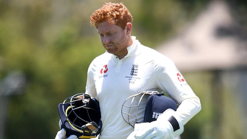 Jonny Bairstow is seen leaving the field with his helmet off after being inured in England tour match in Townsville.